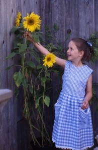 Young girl with sunflowers