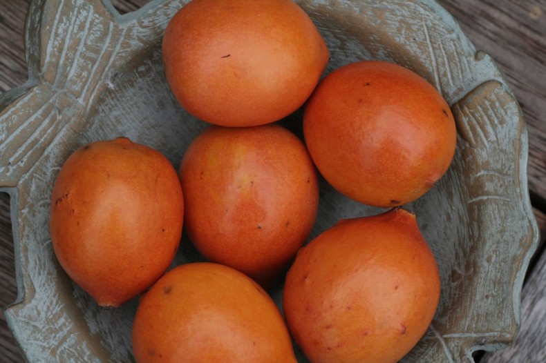 Small egg-shaped orange achacha fruit